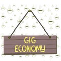 Writing note showing Gig Economy. Business photo showcasing free market system in which temporary positions are common Wood plank