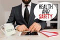 Writing note showing Health And Safety. Business photo showcasing procedures intended to prevent accident in workplace. Royalty Free Stock Photo