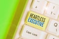 Writing note showing Heartless Executive. Business photo showcasing workmate showing a lack of empathy or compassion. Royalty Free Stock Photo