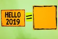 Writing note showing Hello 2019. Business photo showcasing Hoping for a greatness to happen for the coming new year Orange paper n