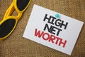 Writing note showing High Net Worth. Business photo showcasing having high-value Something expensive A-class company Sunglass pap Royalty Free Stock Photo