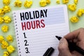 Writing note showing Holiday Hours. Business photo showcasing Celebration Time Seasonal Midnight Sales Extra-Time Opening written Royalty Free Stock Photo