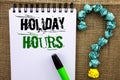 Writing note showing Holiday Hours. Business photo showcasing Celebration Time Seasonal Midnight Sales Extra-Time Opening written Royalty Free Stock Photo