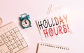 Writing note showing Holiday Hours. Business photo showcasing Overtime work on for employees under flexible work