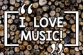 Writing note showing I Love Music. Business photo showcasing Having affection for good sounds lyric singers musicians Wooden Royalty Free Stock Photo