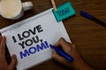 Writing note showing I Love You, Mom. Business photo showcasing Loving message emotional feelings affection warm declaration Hand