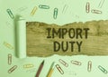 Writing note showing Import Duty. Business photo showcasing tax imposed by a government on goods from other countries Royalty Free Stock Photo