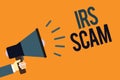 Writing note showing Irs Scam. Business photo showcasing targeted taxpayers by pretending to be Internal Revenue Service Megaphone
