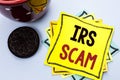 Writing note showing Irs Scam. Business photo showcasing Warning Scam Fraud Tax Pishing Spam Money Revenue Alert Scheme written o Royalty Free Stock Photo