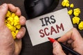 Writing note showing Irs Scam. Business photo showcasing Warning Scam Fraud Tax Pishing Spam Money Revenue Alert Scheme written b Royalty Free Stock Photo