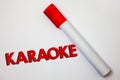 Writing note showing Karaoke. Business photo showcasing Entertainment singing along instrumental music played by a machine Bold bo