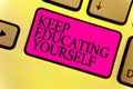 Writing note showing Keep Educating Yourself. Business photo showcasing dont stop studying Improve yourself using Courses Keyboard Royalty Free Stock Photo