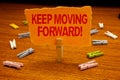 Writing note showing Keep Moving Forward Motivational Call. Business photo showcasing Optimism Progress Persevere Move Paperclip