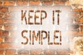 Writing note showing Keep It Simple. Business photo showcasing Simplify Things Easy Understandable Clear Concise Ideas Brick Wall