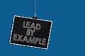 Writing note showing Lead By Example. Business photo showcasing Be a mentor leader follow the rules give examples Coach Hanging bl