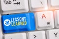 Writing note showing Lessons Learned. Business photo showcasing the knowledge or understanding gained by experience Royalty Free Stock Photo