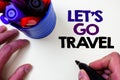 Writing note showing Let'S Go Travel. Business photo showcasing Going away Travelling Asking someone to go outside Trip Blue pen