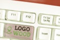 Writing note showing Logo Wood. Business photo showcasing Recognizable design or symbol of a company inscribed on wood.