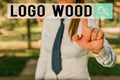 Writing note showing Logo Wood. Business photo showcasing Recognizable design or symbol of a company inscribed on wood