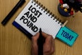 Writing note showing Lost And Found. Business photo showcasing Place where you can find forgotten things Search service Man holdin Royalty Free Stock Photo