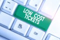 Writing note showing Low Cost Tickets. Business photo showcasing small paper bought to provide access to service or show Royalty Free Stock Photo