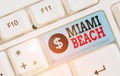 Writing note showing Miami Beach. Business photo showcasing the coastal resort city in MiamiDade County of Florida.