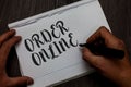 Writing note showing Order Online. Business photo showcasing Buying goods and services from the sellers over the internet Man hand Royalty Free Stock Photo