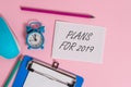 Writing note showing Plans For 2019. Business photo showcasing an intention or decision about what one is going to do Royalty Free Stock Photo