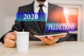 Writing note showing 2020 Predictions. Business photo showcasing statement about what you think will happen in 2020 Male human