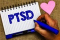 Writing note showing Ptsd. Business photo showcasing Post Traumatic Stress Disorder Mental Illness Trauma Fear Depression Notepad