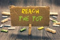Writing note showing Reach The Top. Business photo showcasing Get Ahead Succeed Prosper Thrive for the Win Victory Clothespin hold