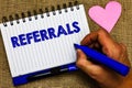 Writing note showing Referrals. Business photo showcasing Act of referring someone or something for consultation review Notepad pe Royalty Free Stock Photo