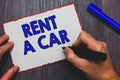 Writing note showing Rent A Car. Business photo showcasing paying for temporary vehicle usage from one day to months Man holding m Royalty Free Stock Photo