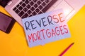 Writing note showing Reverse Mortgages. Business photo showcasing borrower to access the unencumbered value of the property