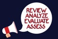 Writing note showing Review Analyze Evaluate Assess. Business photo showcasing Evaluation of performance feedback process Man hold