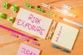 Writing note showing Risk Exposure. Business photo showcasing the quantified potential loss that might occur in a business Colored