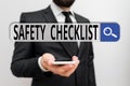 Writing note showing Safety Checklist. Business photo showcasing list of items you need to verify, check or inspect Male