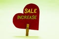 Writing note showing Sale Increase. Business photo showcasing Average Sales Volume has Grown Boost Income from Leads Clothespin ho Royalty Free Stock Photo