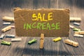 Writing note showing Sale Increase. Business photo showcasing Average Sales Volume has Grown Boost Income from Leads Clothespin ho Royalty Free Stock Photo