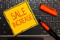 Writing note showing Sale Increase. Business photo showcasing Average Sales Volume has Grown Boost Income from Leads Yellow paper Royalty Free Stock Photo