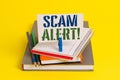 Writing note showing Scam Alert. Business photo showcasing fraudulently obtain money from victim by persuading him Book