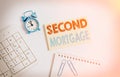 Writing note showing Second Mortgage. Business photo showcasing lien on property which is subordinate to more senior one Keyboard