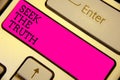 Writing note showing Seek The Truth. Business photo showcasing Looking for the real facts Investigate study discover Keyboard pink