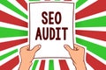 Writing note showing Seo Audit. Business photo showcasing Search Engine Optimization validating and verifying process Man holding Royalty Free Stock Photo
