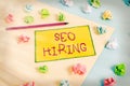 Writing note showing Seo Hiring. Business photo showcasing employing a specialist will develop content to include