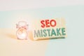 Writing note showing Seo Mistake. Business photo showcasing action or judgment that is misguided or wrong in search engine Alarm