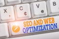 Writing note showing Seo And Web Optimization. Business photo showcasing Search Engine Keywording Marketing Strategies Royalty Free Stock Photo