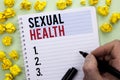 Writing note showing Sexual Health. Business photo showcasing STD prevention Use Protection Healthy Habits Sex Care written By Ma Royalty Free Stock Photo