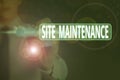 Writing note showing Site Maintenance. Business photo showcasing keeping the website secure updated running and bugfree Royalty Free Stock Photo