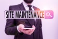 Writing note showing Site Maintenance. Business photo showcasing keeping the website secure updated running and bugfree Male human Royalty Free Stock Photo